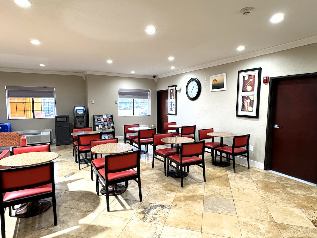 Breakfast seating area at Quality Inn & Suites McAlester on Hwy 69